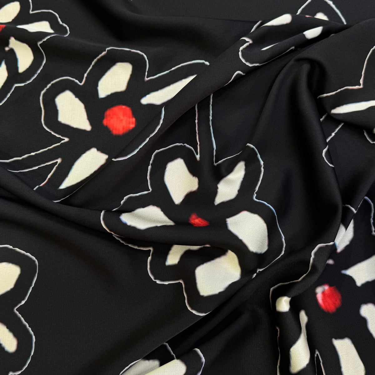 SATIN DE POLYESTER IMPRIMÉ MARGUERITES FOND NOIR - My Little Coupon
