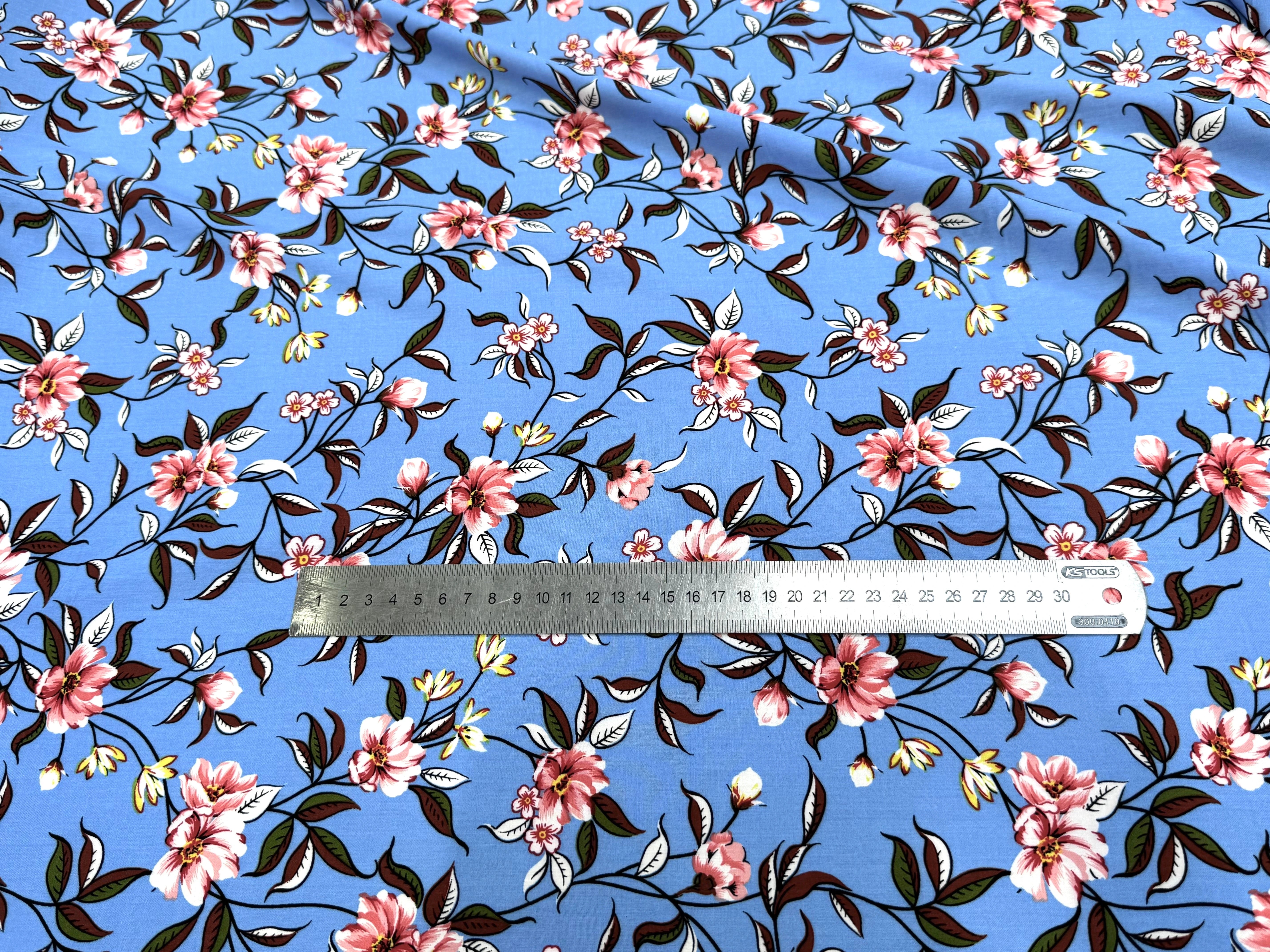 TISSU 100% VISCOSE IMPRIMÉ FOND BLEU CIEL - My Little Coupon