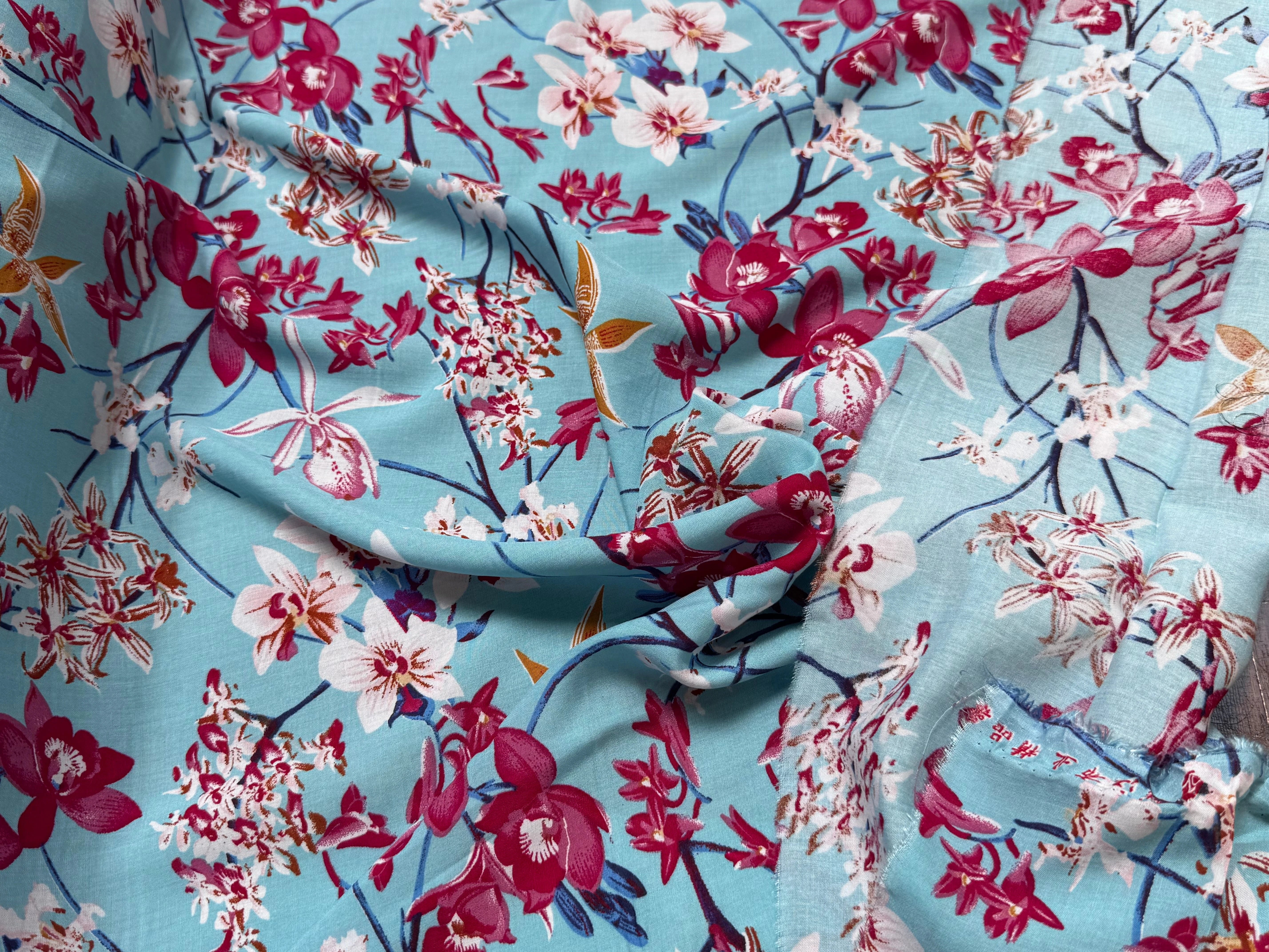 TISSU 100% VISCOSE IMPRIMÉ MOTIFS FLOREAUX FOND TURQUOISE - My Little Coupon