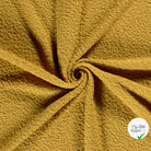 Bouclette stretch unie ocre
