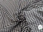 CRÊPE DE VISCOSE IMPRIMÉ SEMIS DE FLEURS FOND NOIR - My Little Coupon