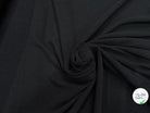 Tissu crêpe gaufré noir légèrement stretch au tombé plombant, effet double gaze