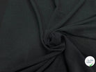 Tissu crêpe gaufré noir légèrement stretch au tombé plombant, effet double gaze
