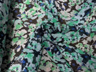 CRÉPON VISCOSE FOND NOIR MOTIFS FLEURS BLANC ET VERT - My Little Coupon