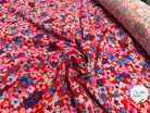 VISCOSE TOUCHÉ PEAU DE PÊCHE IMPRIMÉ FLEURS FOND ROUGE - My Little Coupon