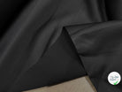 GABARDINE CONTRECOLLÉE DOUBLE ETOFFE NOIR UNE FACE LEGEREMENT BRILLANTE - My Little Coupon