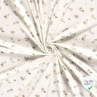 Jersey de coton fleurs blanc cassé
