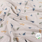 JERSEY DE COTON IMPRIMÉ DINOSAURES FOND SABLE - My Little Coupon