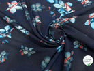 MAILLE VISCOSE STRETCH IMPRIMÉ GRANDES FLEURS BLEU CIEL FOND MARINE - My Little Coupon