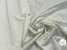 Tissu popeline de coton stretch craquante écru - vue de la matière