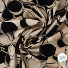 Sergé de viscose EcoVero cercles sable - drapé