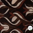 Teddy jacquard brun foncé - détail du motif tissé