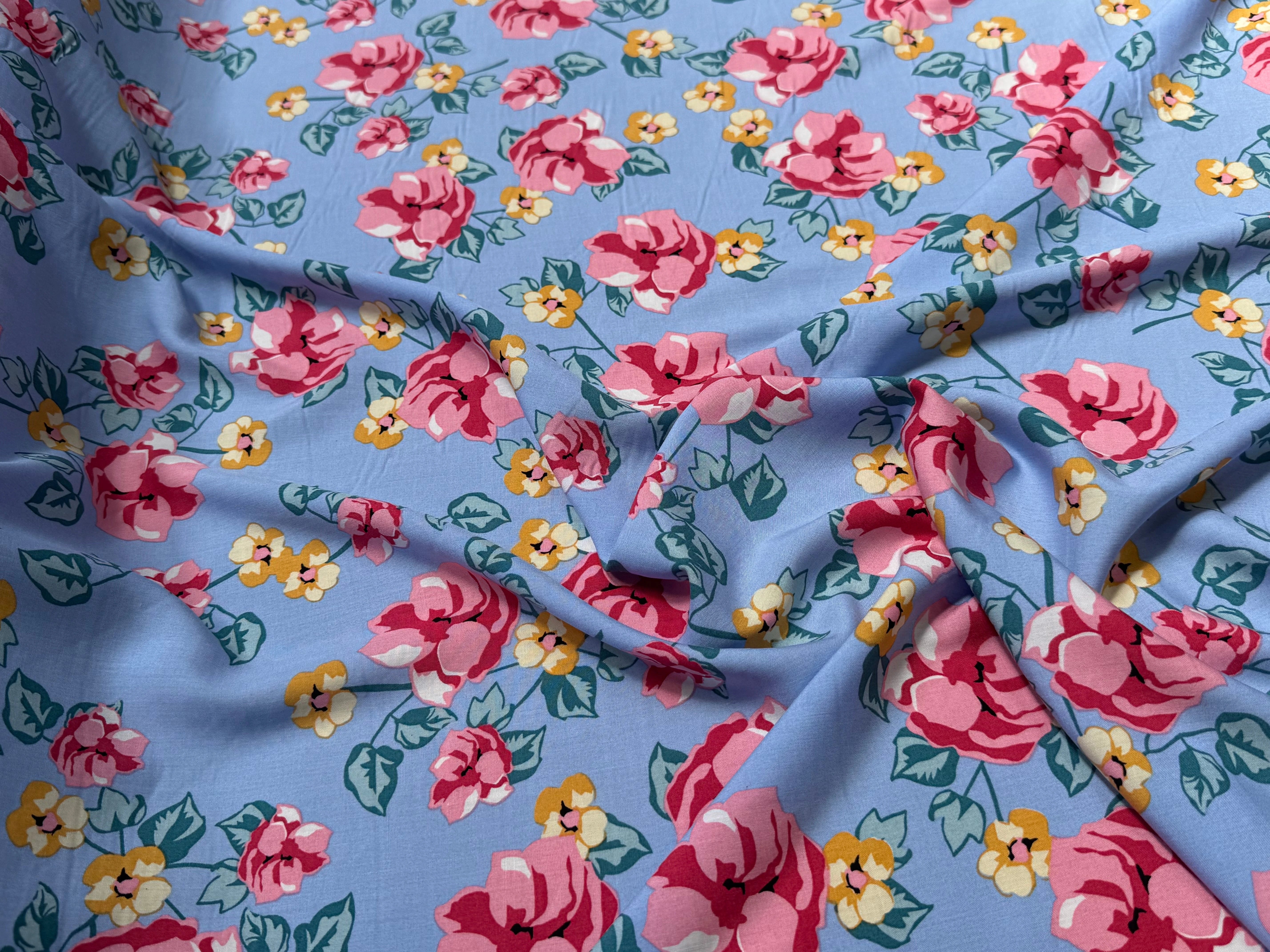 TISSU 100% VISCOSE IMPRIMÉ BRANCHES À FLEURS FOND BLEU CIEL - My Little Coupon