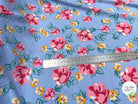 TISSU 100% VISCOSE IMPRIMÉ BRANCHES À FLEURS FOND BLEU CIEL - My Little Coupon