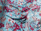 TISSU 100% VISCOSE IMPRIMÉ MOTIFS FLOREAUX FOND TURQUOISE - My Little Coupon