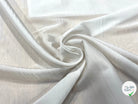 TISSU CREPE LÉGÈREMENT SATINÉ FLUIDE BLANC CASSÉ - My Little Coupon