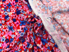 VISCOSE D'UNE MULTITUDE DE FLEURS FOND ROUGE MLC INTERN