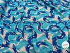 VISCOSE FLUIDE FOND BLANC IMPRIMÉE TOURBILLON ROI TURQUOISE - My Little Coupon