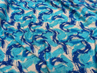 VISCOSE FLUIDE FOND BLANC IMPRIMÉE TOURBILLON ROI TURQUOISE - My Little Coupon