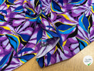 VISCOSE FLUIDE FOND VIOLET MOTIFS FEUILLAGES BLEU NOIR - My Little Coupon