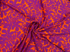 VISCOSE IMPRIMÉE FLEURS VIOLETTES SUR LIT D'ORANGE MSO